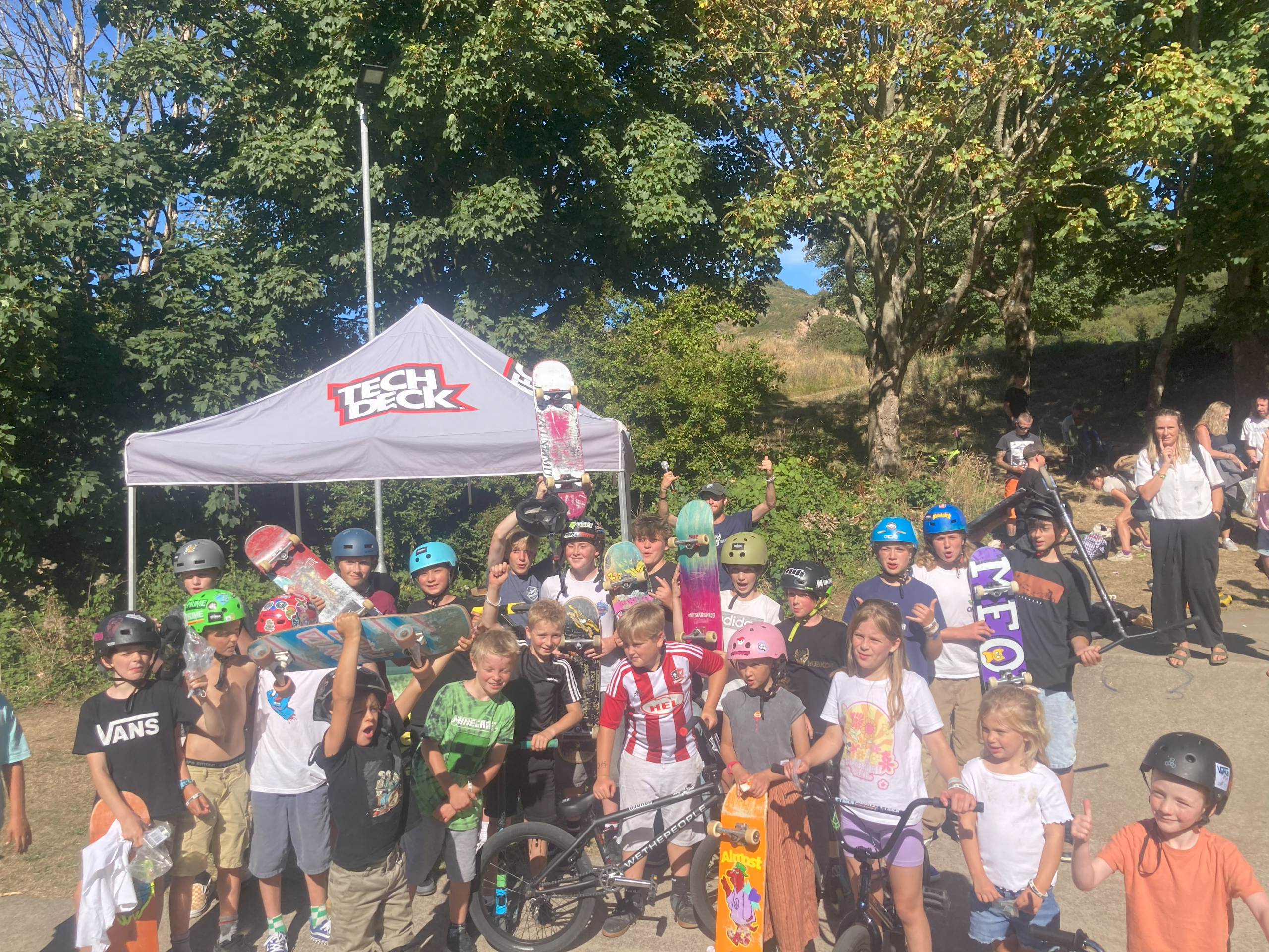Young people with skateboards, scooters and BMX bikes at Ilfracombe Youth Club's skate jam