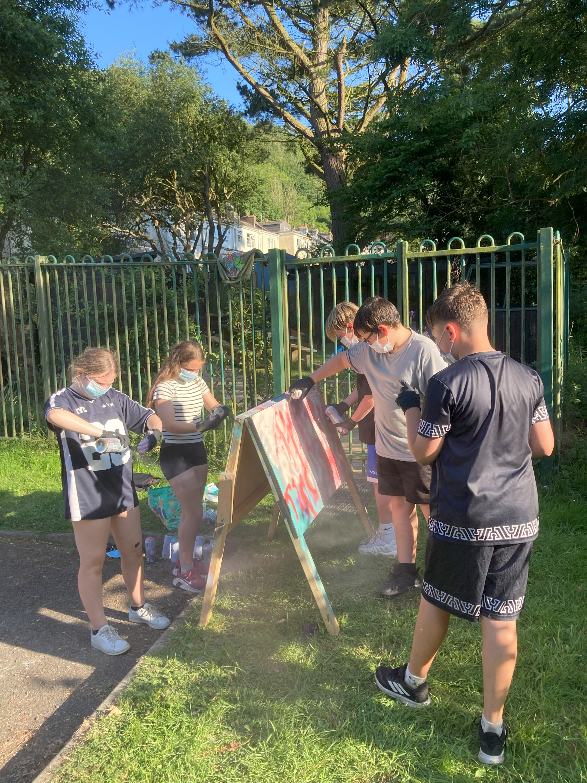 Young people taking part in a street art workshop at Ilfracombe Youth Club